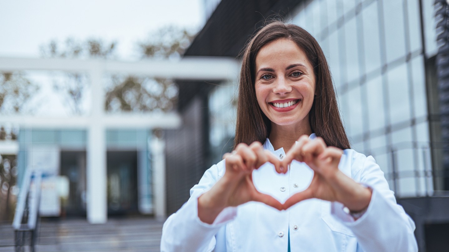 Woman provider holding hands in a heart shape