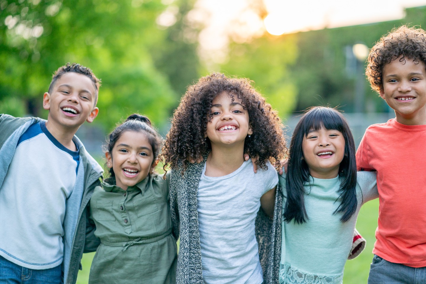 Group of happy kids standing outside