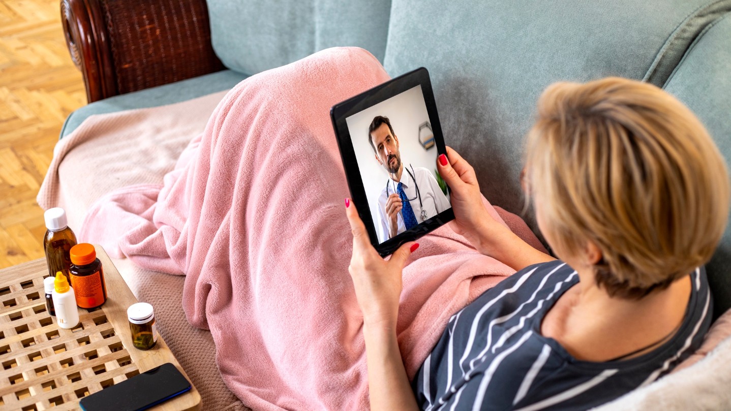 Older woman sick and calling the virtual doctor